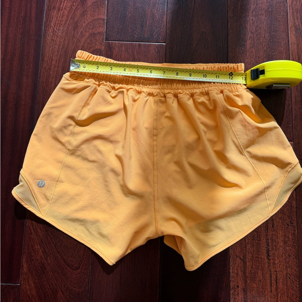 Selling Lululemon shorts size 6 in orange color - Picture 7 of 9